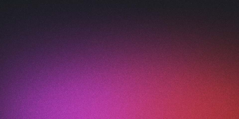 A person sitting on a rock looking at a starry night sky.